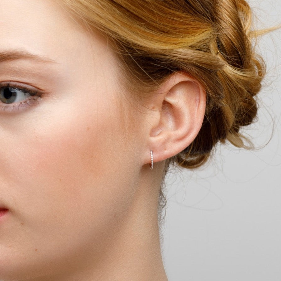 Round earrings with white diamonds 0.06 ct