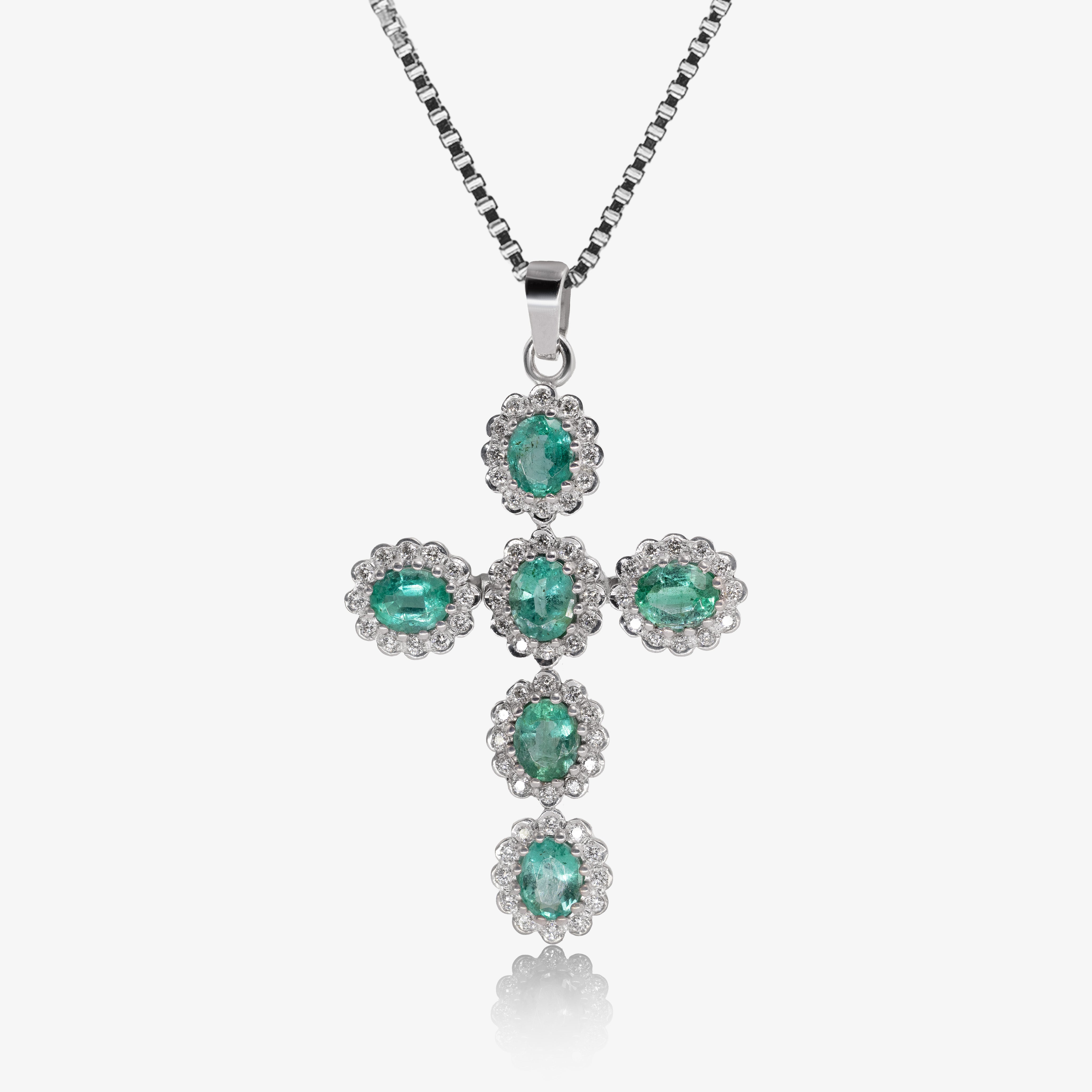 Pendant cross with emeralds
