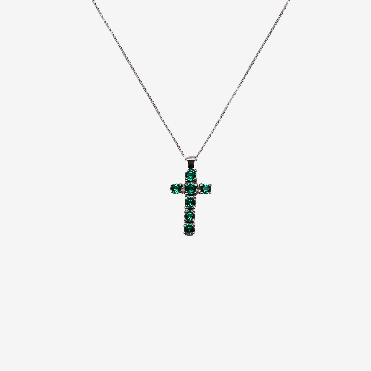 Cross necklace with emeralds